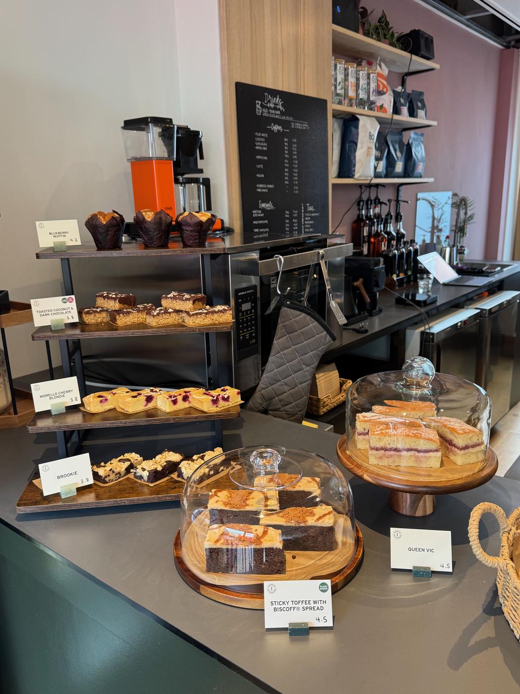 Cakes and muffins on the counter at Rose & Stone